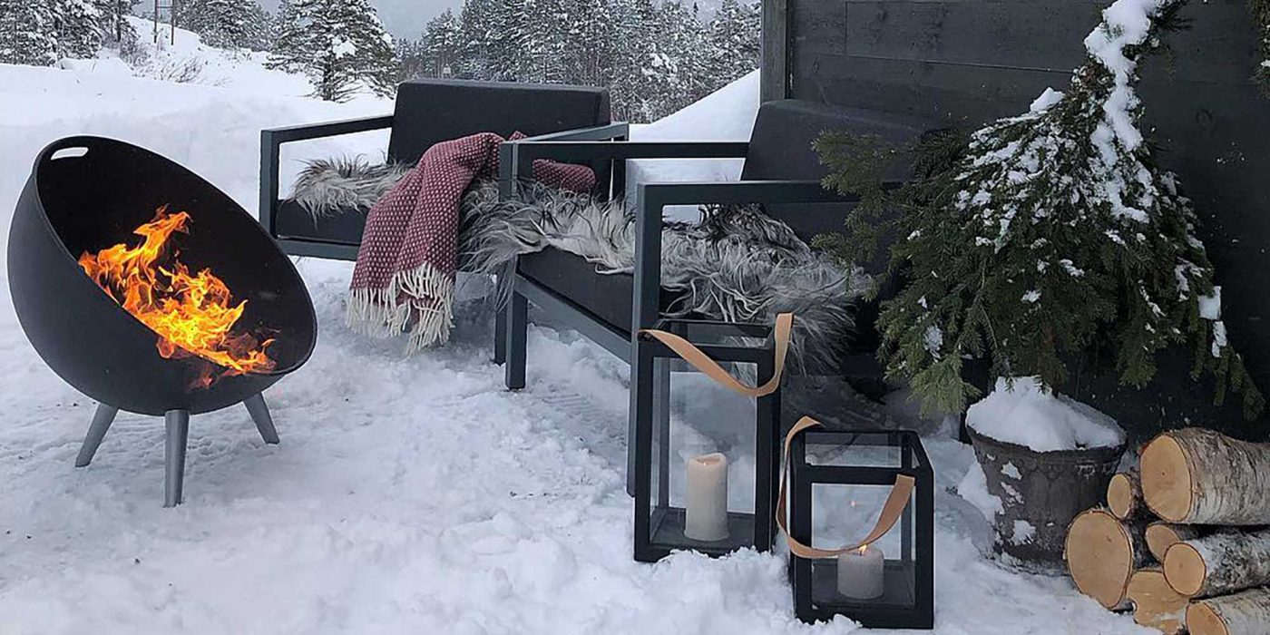Sundays Frame lounge outdoor furniture with snow and fireplace